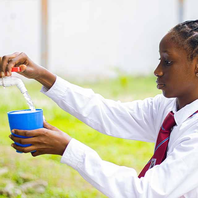 grabbing clean water at school